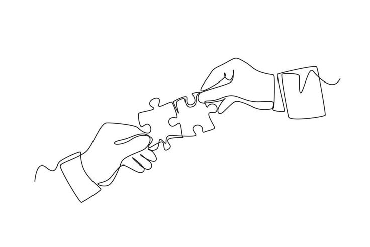 Hands working together to assemble puzzle pieces.